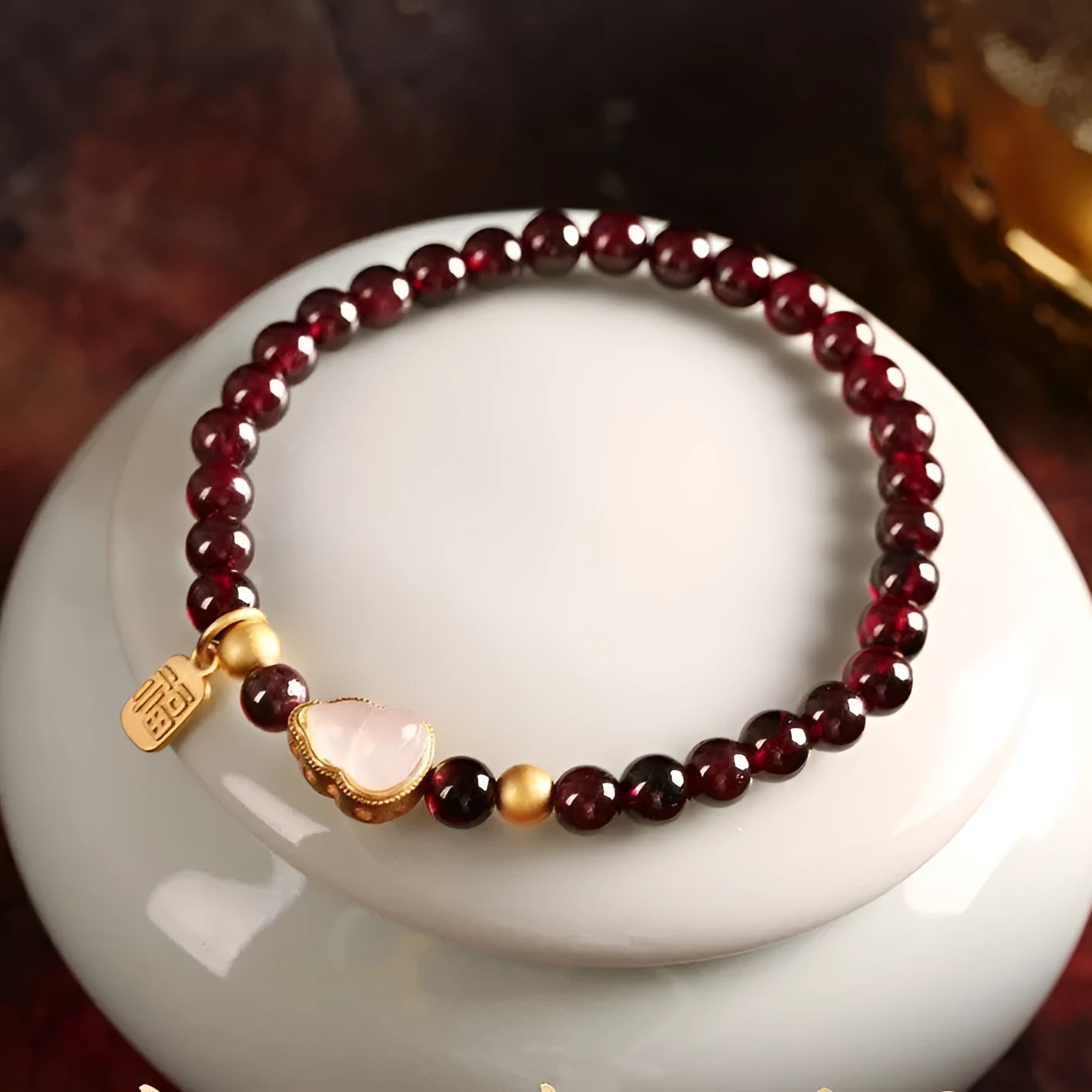 Chinese-style women's gourd bracelet with imitation garnet beads and Fu character.