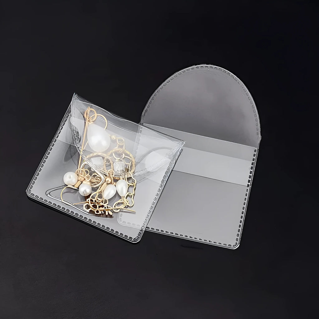 Transparent PVC soft badge bag 0.2mm thick holding coins on a flat surface