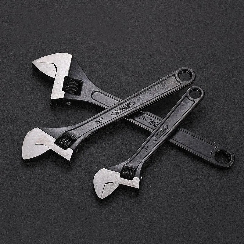 A black high carbon steel adjustable wrench on a white background, showing its open jaws and knurled adjustment screw.