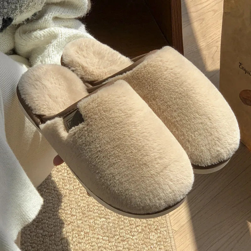 Pair of solid colour plush PVC winter slippers with non-slip soles for home use.