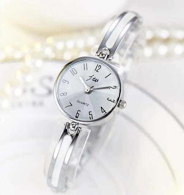 Steel belt fashion watch with gold or silver finish, 2.5cm dial, mineral glass, and steel strap on a white background