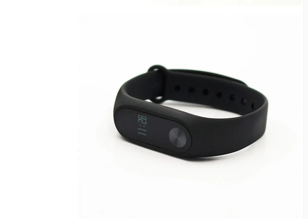 Black Xiaomi Mi Band 2 smart fitness bracelet with OLED display on adjustable wrist strap
