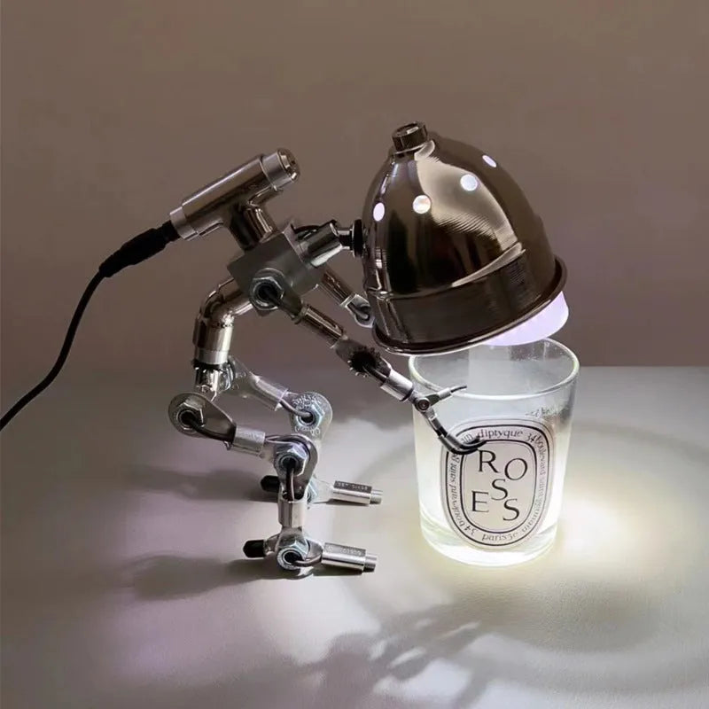 Robot-shaped atmosphere lamp with metallic silver copper finish in 22cm or 29cm sizes