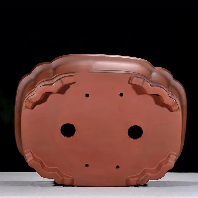 Large antique finish purple clay flower pot with Chinese tree stump design showing pine cypress pomegranate motifs