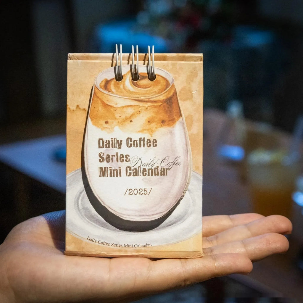Coffee Coffee mini desk calendar set showing four 2025 paper calendars with different themes for daily inspiration