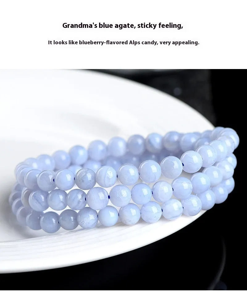 Natural blue agate bracelet showing scattered beads with blue striped pattern and three-circle design