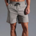 Men's loose fit quick-dry polyester shorts in straight casual style available in four colours
