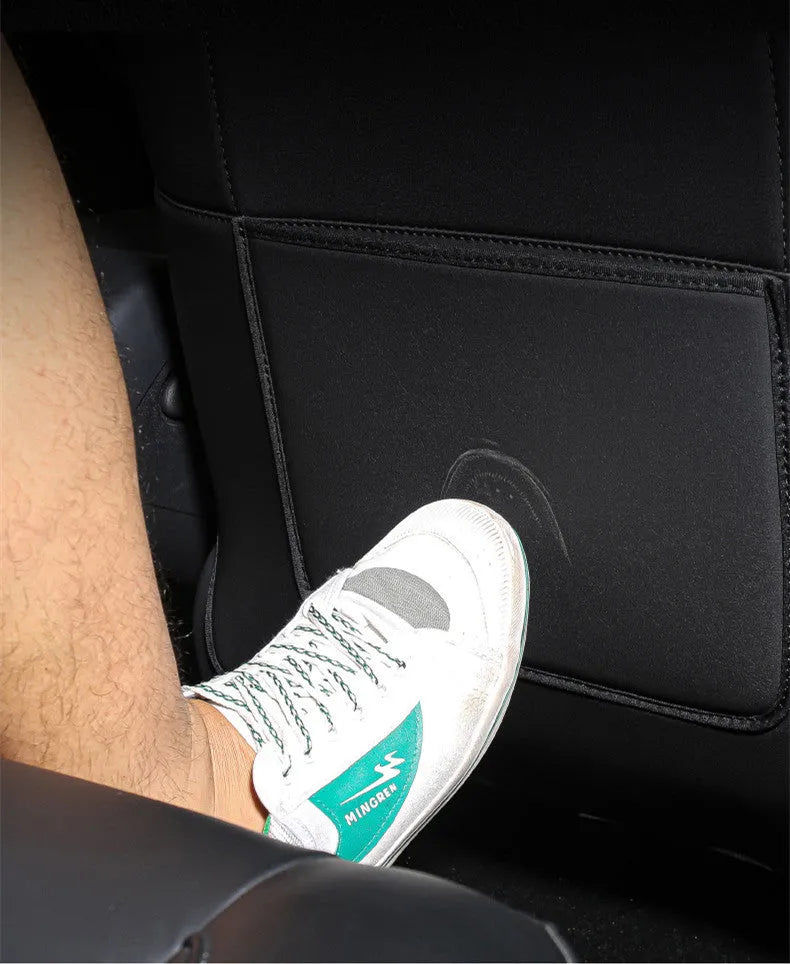 Black leather rear anti kick pad for car seats with a single pocket, shown alongside a tape measure indicating 68cm by 42cm dimensions.