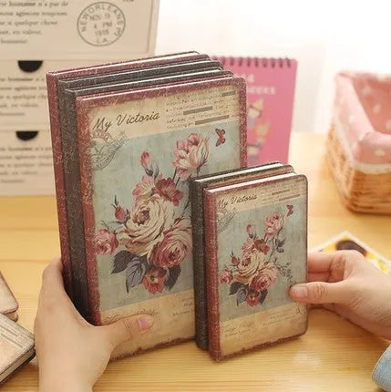 Hardcover notebook with retro floral cloth cover in Lily colour, showing 25K size next to 50K size comparison