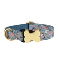 Nylon dog collar with printed grid pattern and a large bone-shaped metal buckle.