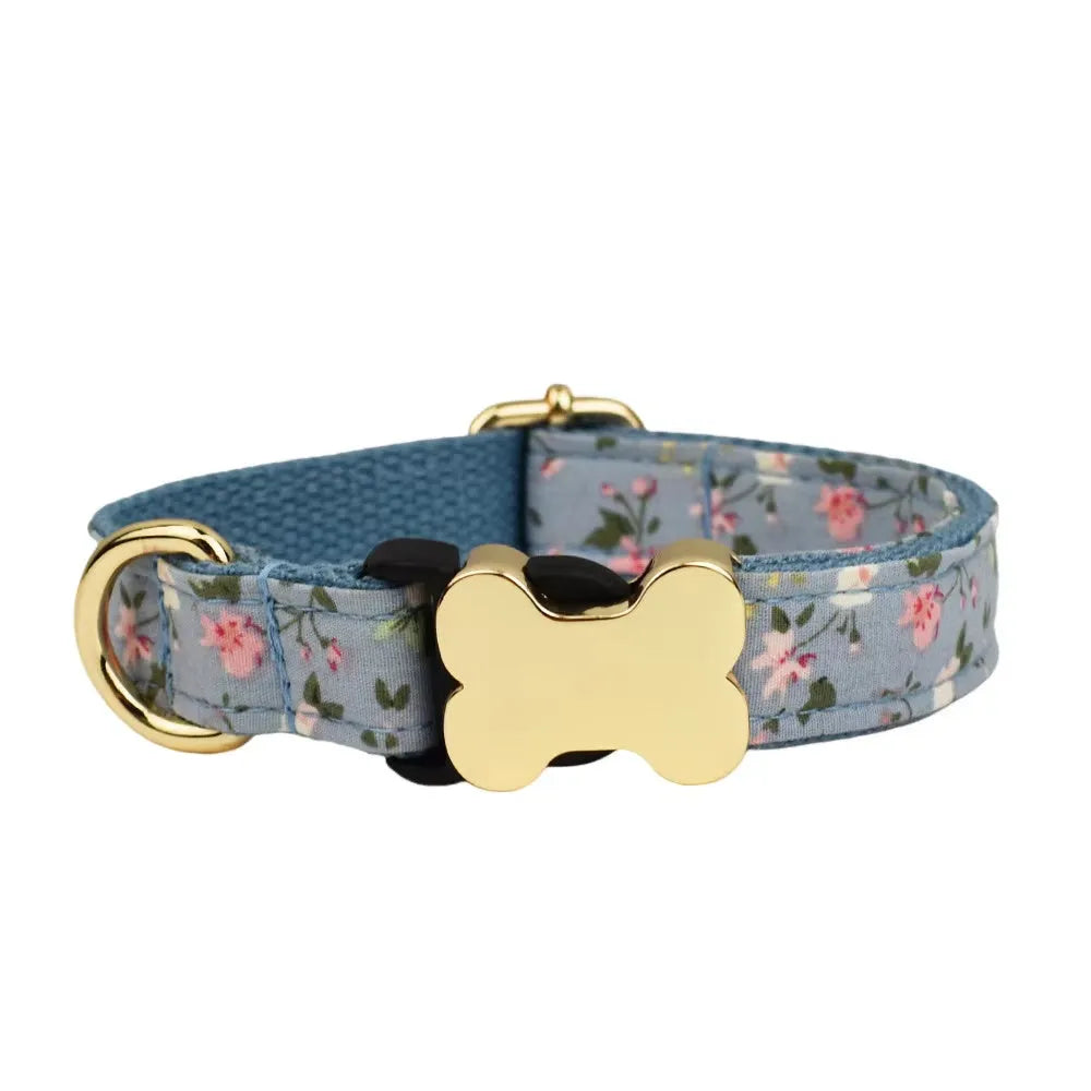 Nylon dog collar with printed grid pattern and a large bone-shaped metal buckle.