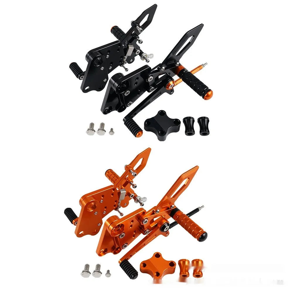 Black and orange KTM Duke motorcycle pedal support bracket assembly