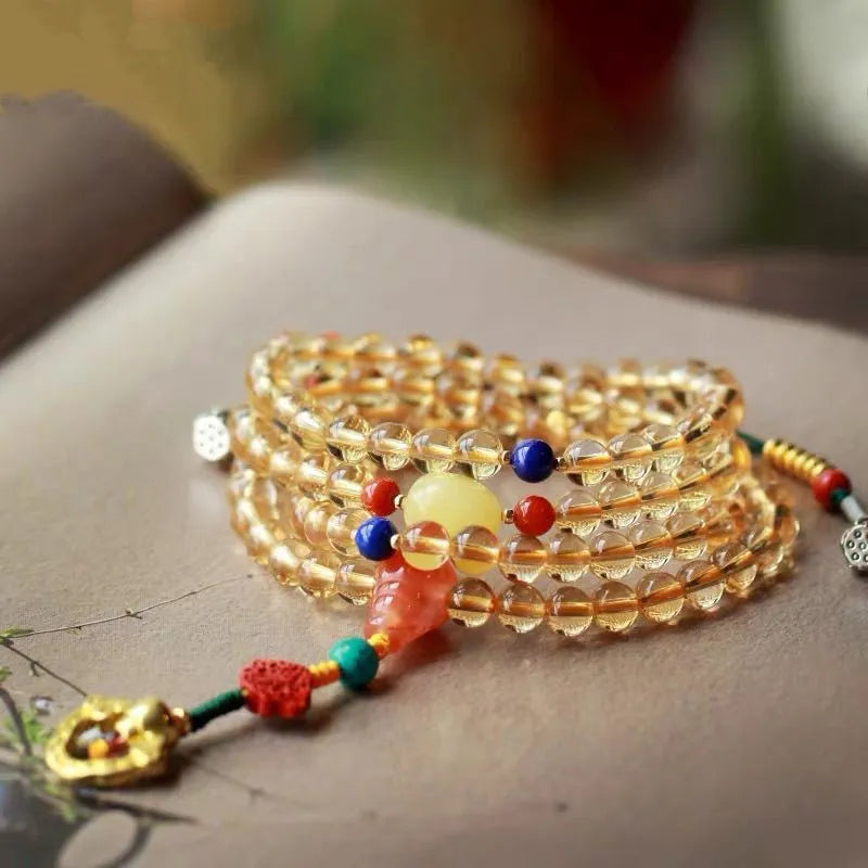 Brazilian citrine bracelet with red and yellow colours on adjustable filament cord