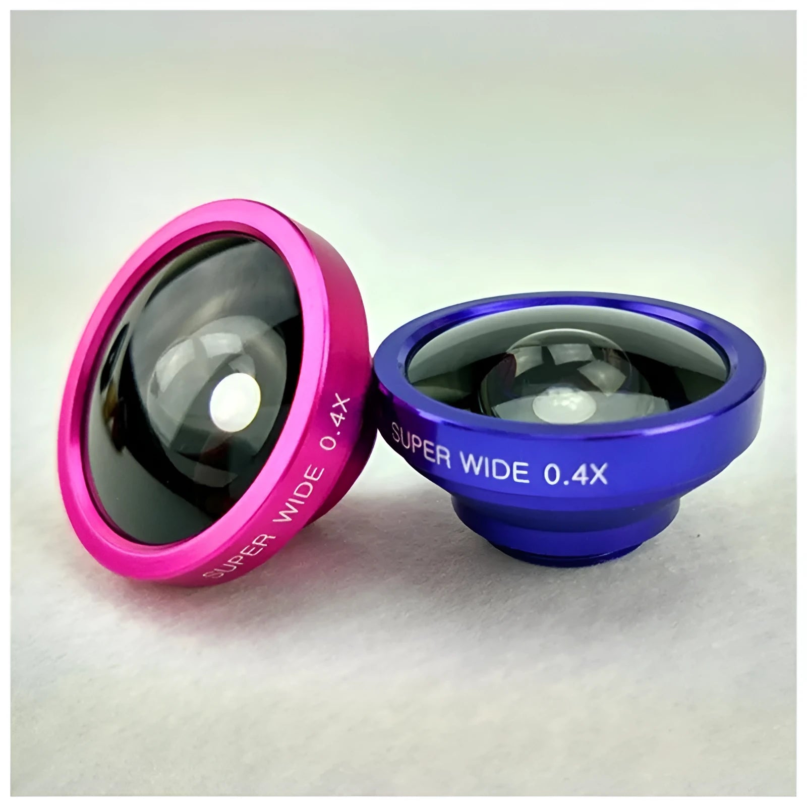 Black 3-in-1 smartphone lens kit showing fisheye lens, wide-angle macro lens, and universal clip on a table