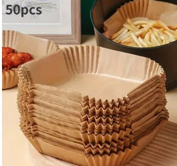 Round white disposable parchment paper liner for air fryer basket with raised edges.