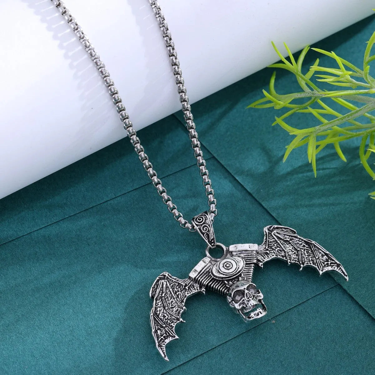 Gothic dark skull alloy necklace with skeleton wing pendant on display