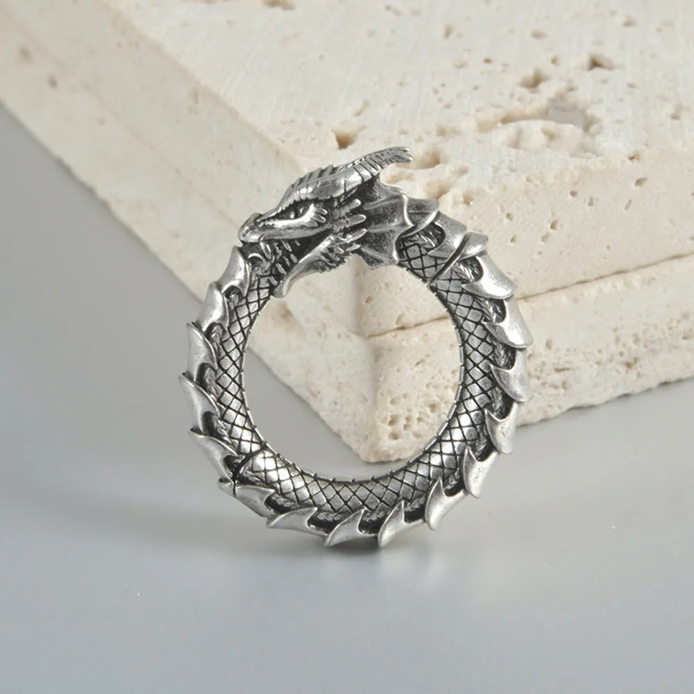 Large antique silver dragon-shaped hollow-out auricle earrings made from stainless steel.