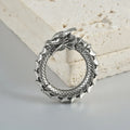 Large antique silver dragon-shaped hollow-out auricle earrings made from stainless steel.