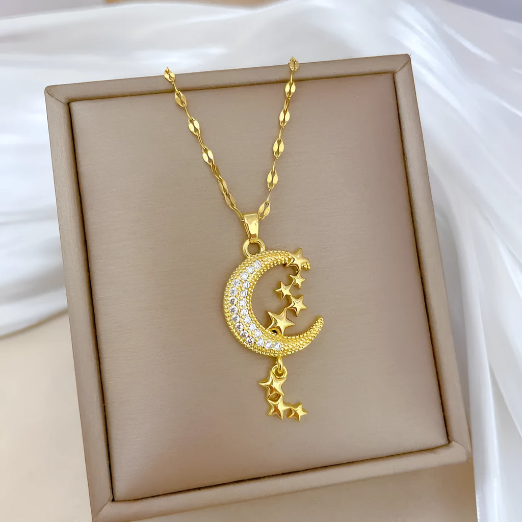 Stainless steel necklace with a geometric moon pendant and tassel chain detail.