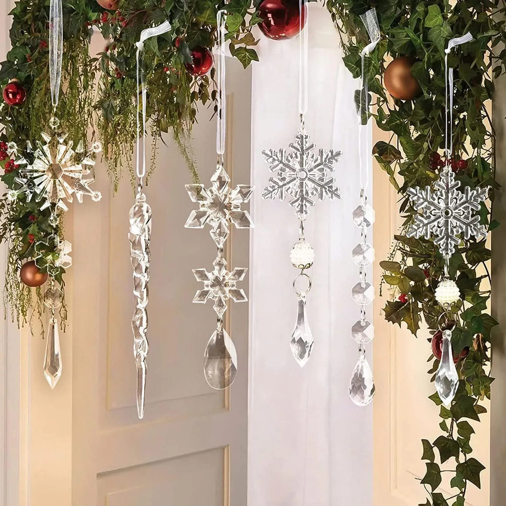 Set of ten clear acrylic icicle and snowflake Christmas ornaments with white hanging ribbons.