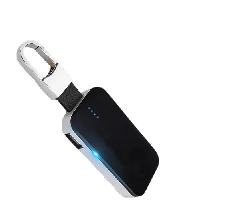 Black portable Apple Watch wireless charger power bank on a keychain.