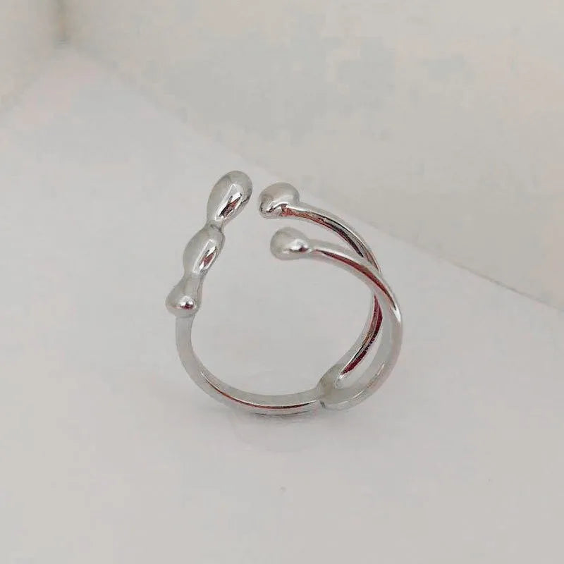 Brass fashion ring with spherical elements in circular design available in gold and silver colours