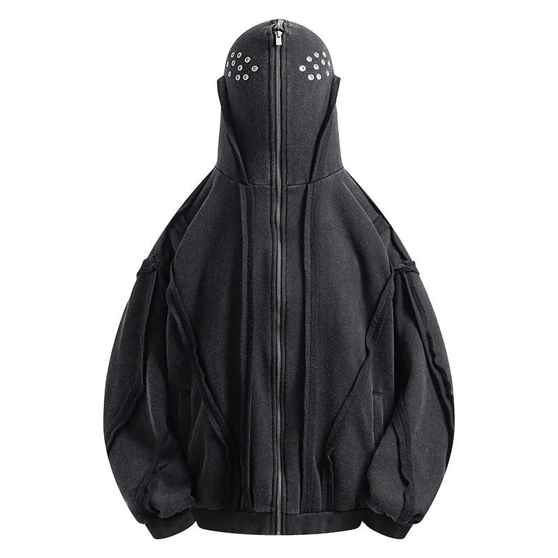 Man wearing a loose black zip-up hooded coat with a padded lining.