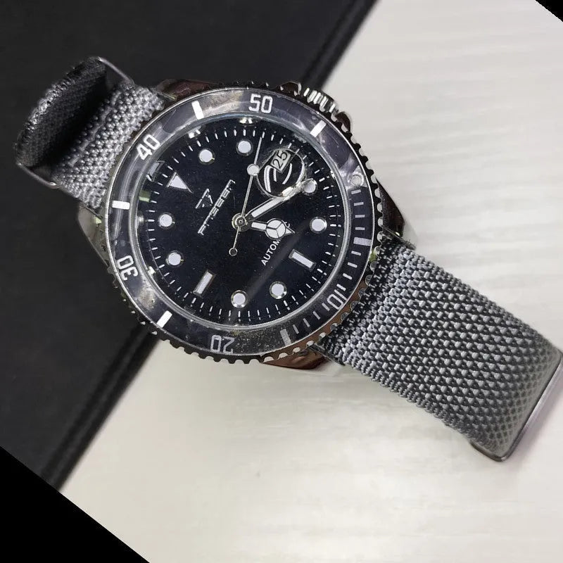 Nylon integrated watch strap in military colours showing integrated design without separate buckles
