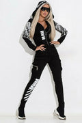Black women's hooded casual suit with print, featuring a zipper top and matching trousers.