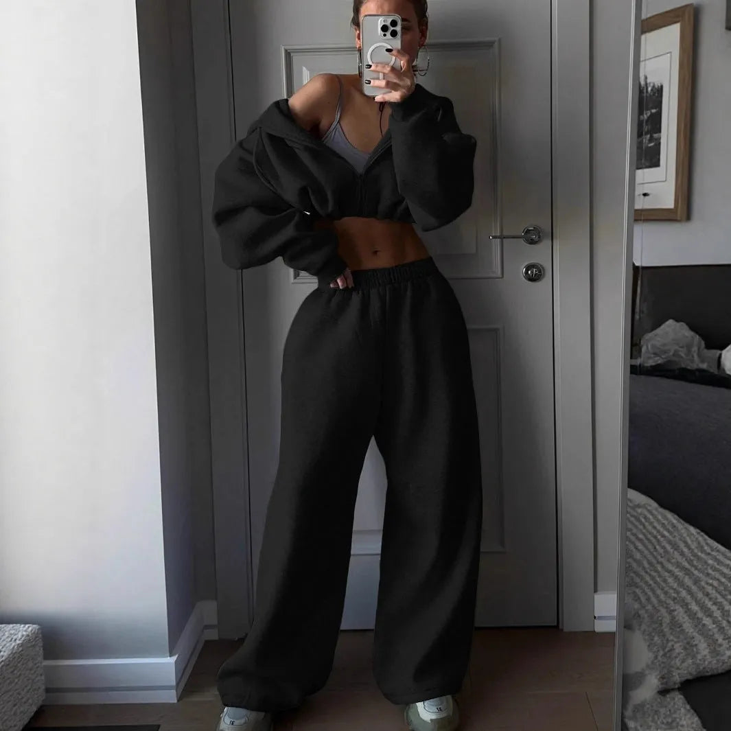 Long sleeve polyester sports sweater suit two-piece set in light grey, showing coat and trousers.
