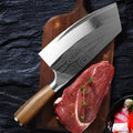 A 320mm long stainless steel kitchen knife with a forged blade on a wooden cutting board.