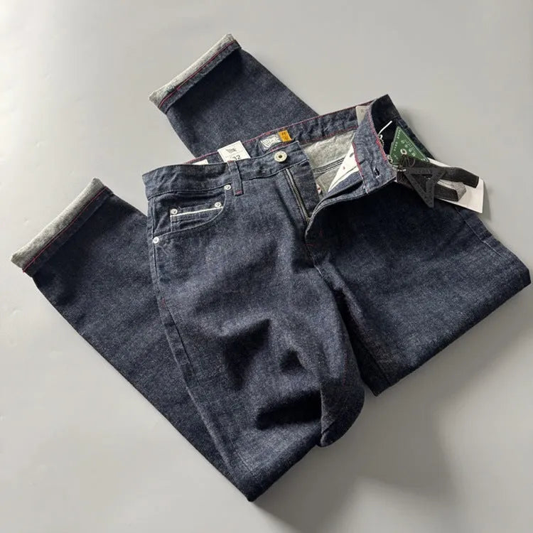 Men's straight leg denim jeans in a primary colour, showing front view of the mid waist and classic cut.