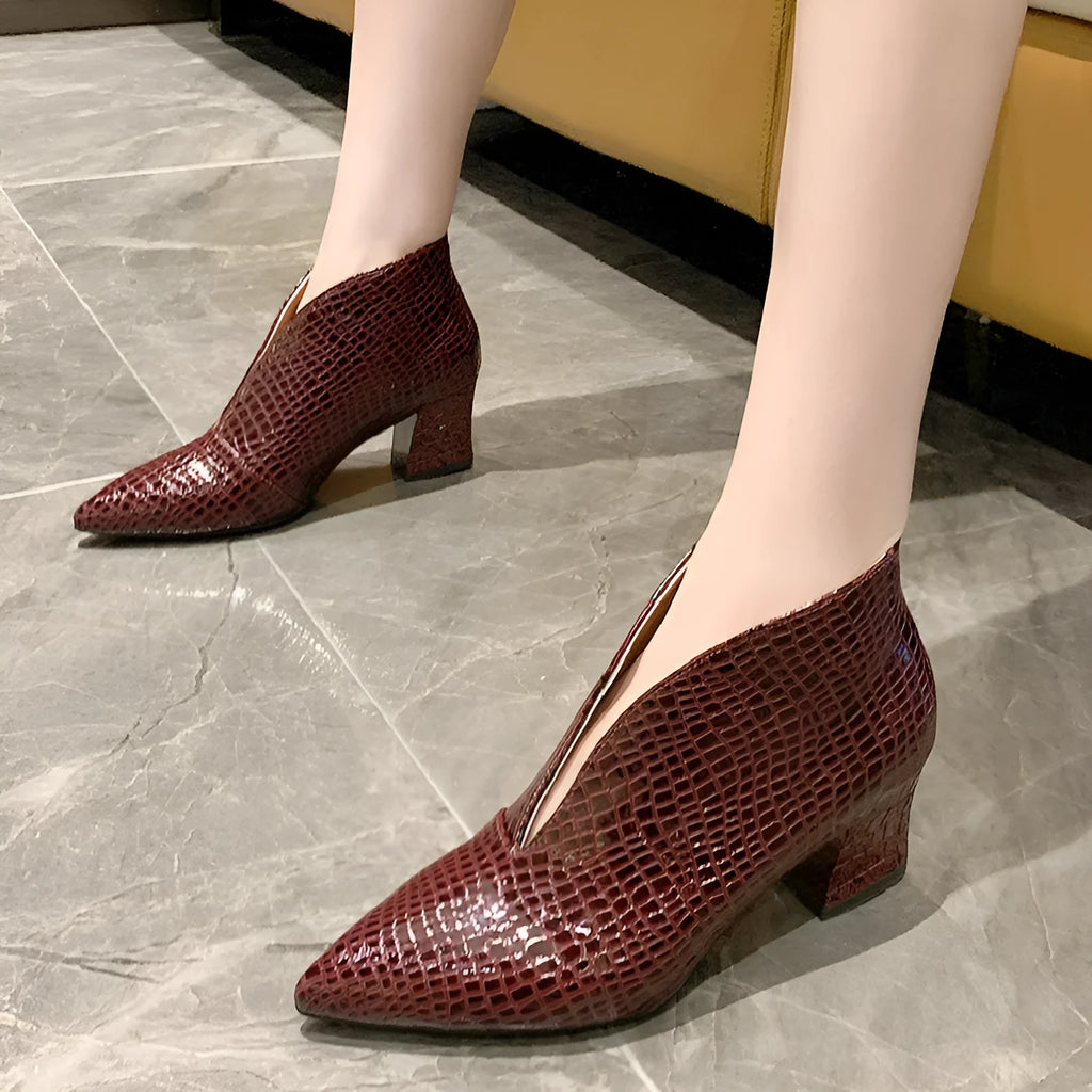 Black women's V-cut pointed ankle boots with an embossed PU upper and a chunky block heel.