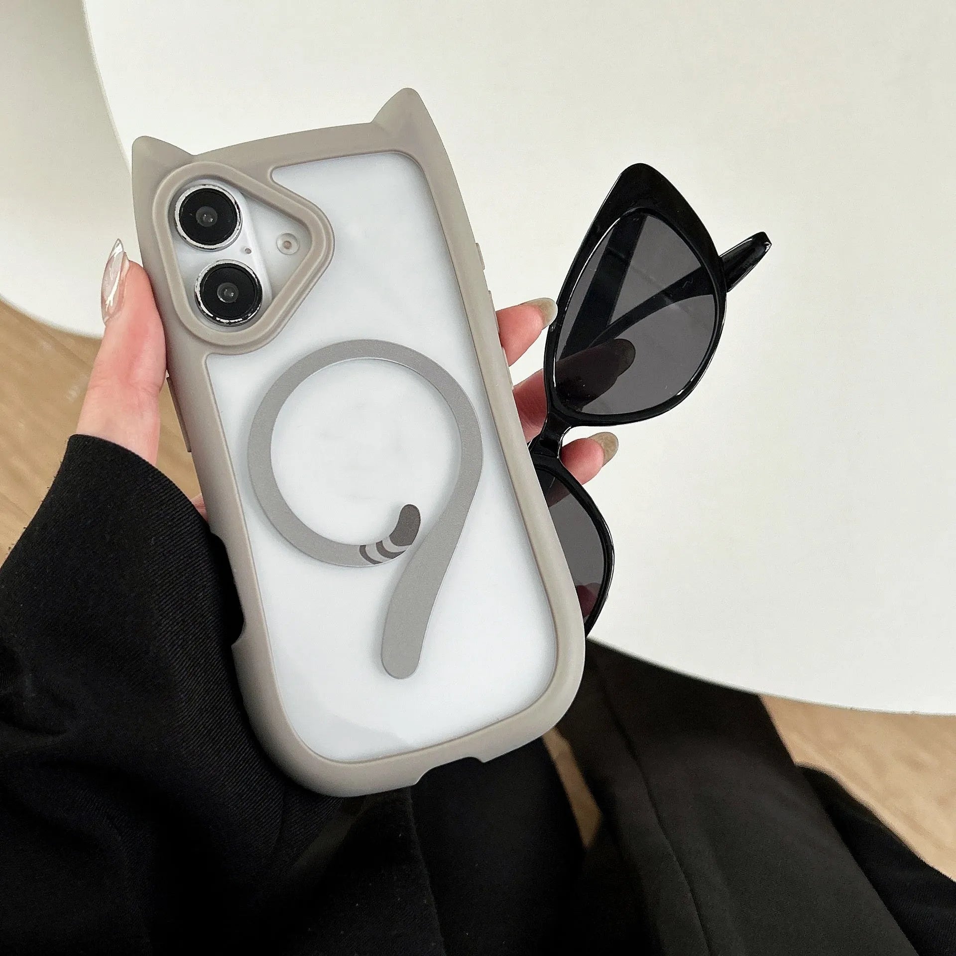 Transparent acrylic and TPU iPhone 17 phone case with magnetic suction in black, blue, grey, and pink colour options.