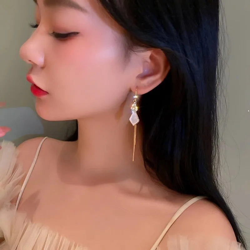 Alloy tassel strip earrings with electroplated finish in white showing Gang Diamond Ice Flower design