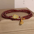 Chinese-style garnet bracelet with U-shaped design and pomegranate elements in antique style