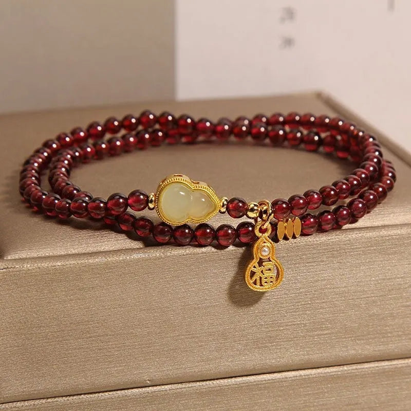 Chinese-style garnet bracelet with U-shaped design and pomegranate elements in antique style