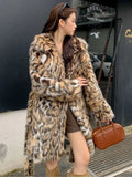 Long faux fur coat with fur collar and pockets in street fashion style