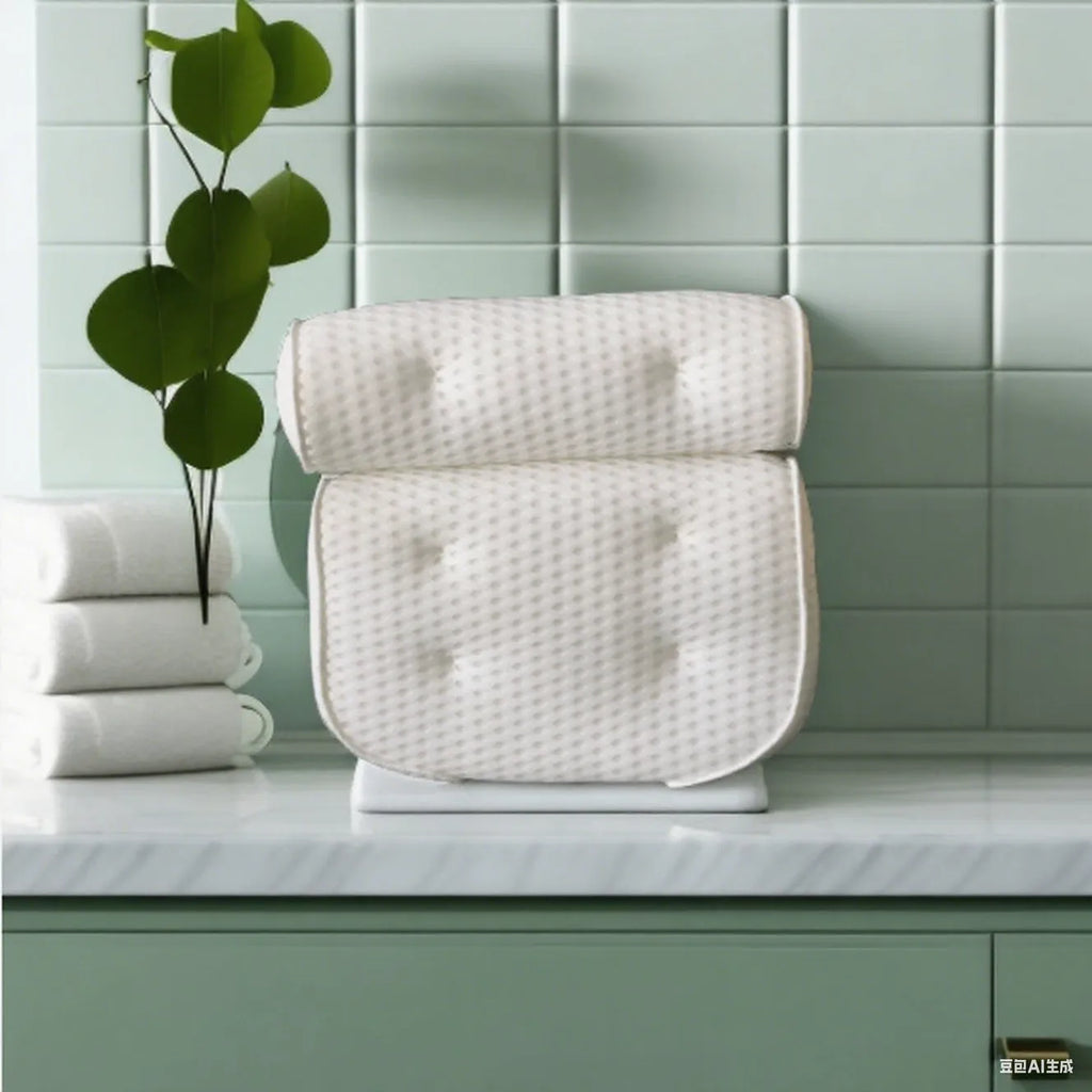 White 4D mesh bathtub pillow with suction cups on a bathtub edge.