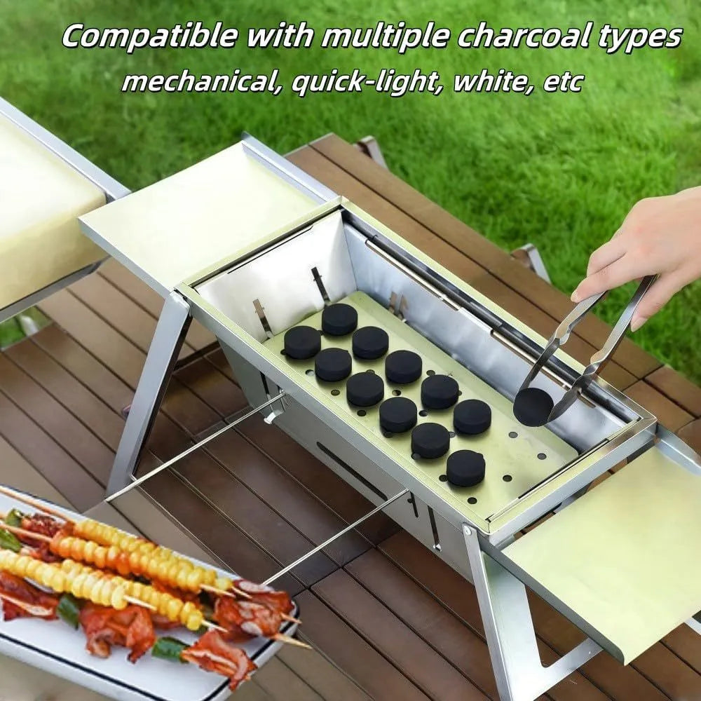 Small foldable portable charcoal grill for outdoor cooking.