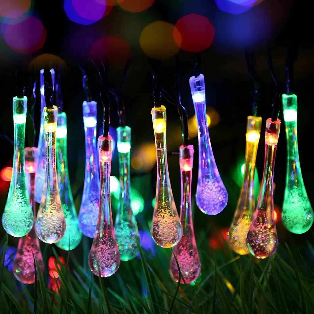 Outdoor solar LED string lights with water drop pendants on a 6.5 metre cable.