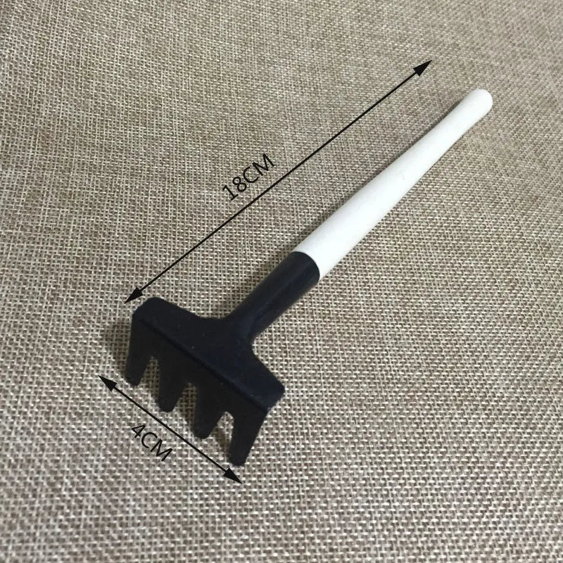Succulent gardening tool set showing watering can, mini shovel, rake, tweezers, and small brush for plant care.