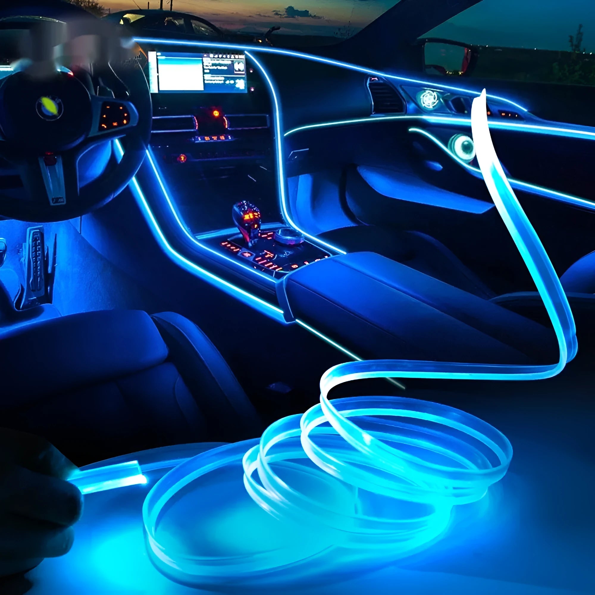 Flexible multicolour LED car ambient light strip with USB connector for 12V power.