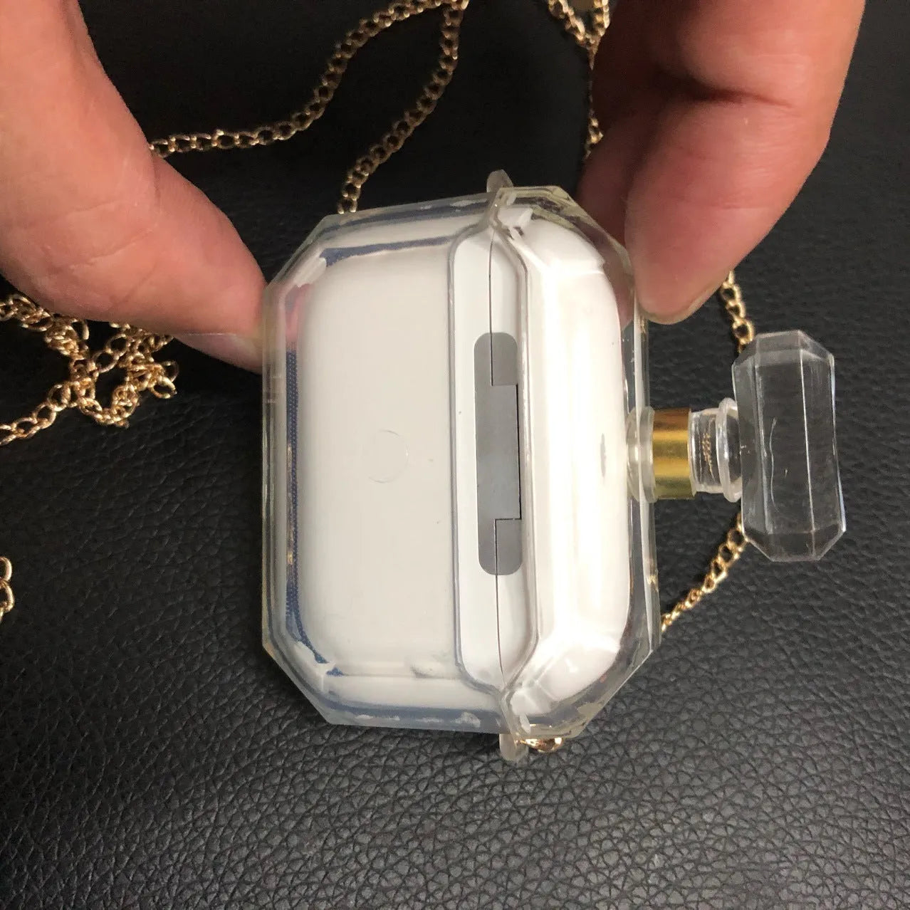 White silicone perfume bottle style case cover for AirPods Pro and AirPods 3 charging box.