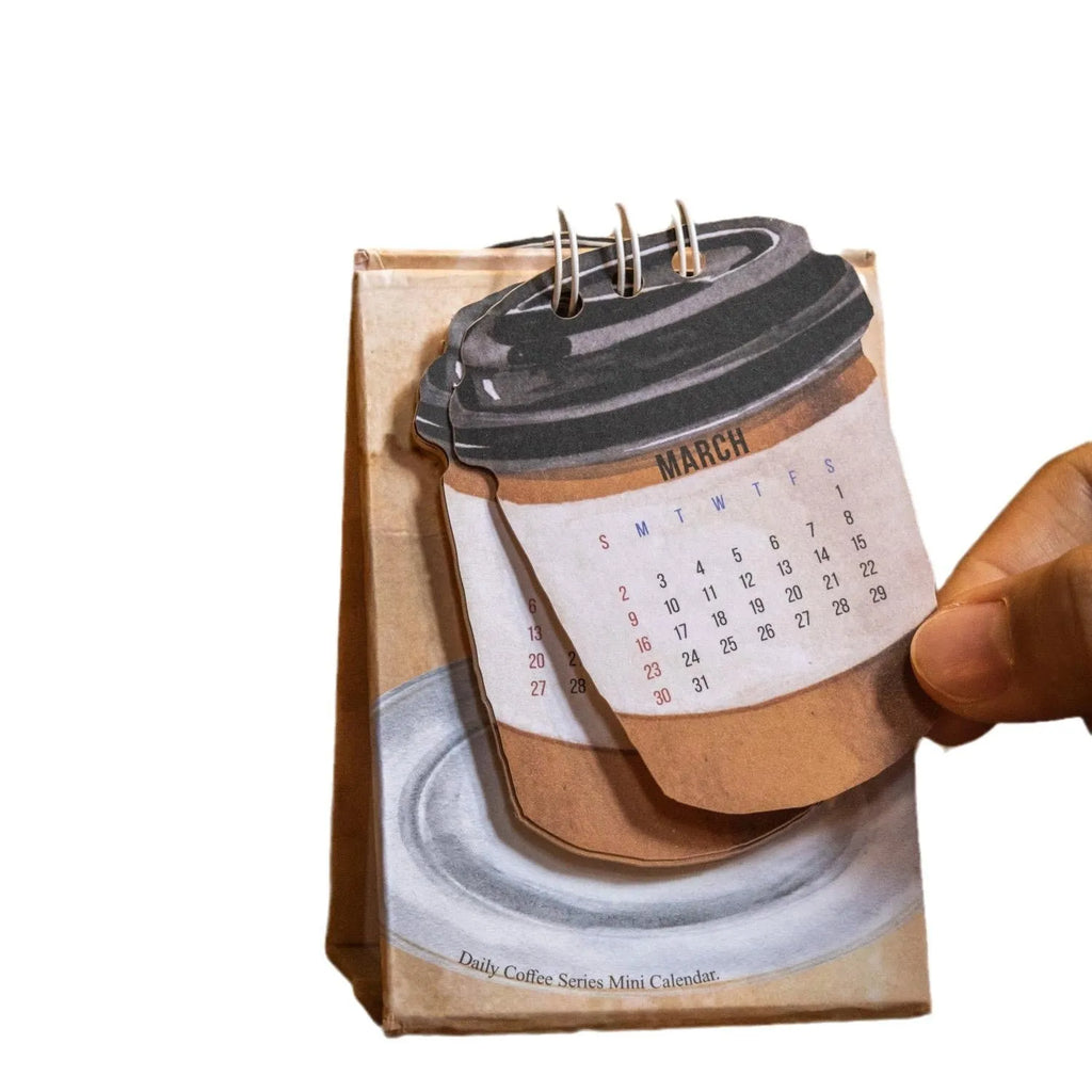 Coffee Coffee mini desk calendar set showing four 2025 paper calendars with different themes for daily inspiration