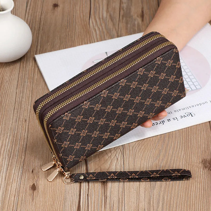Long black PU leather wallet clutch with phone slot, card holders, and zippered coin purse