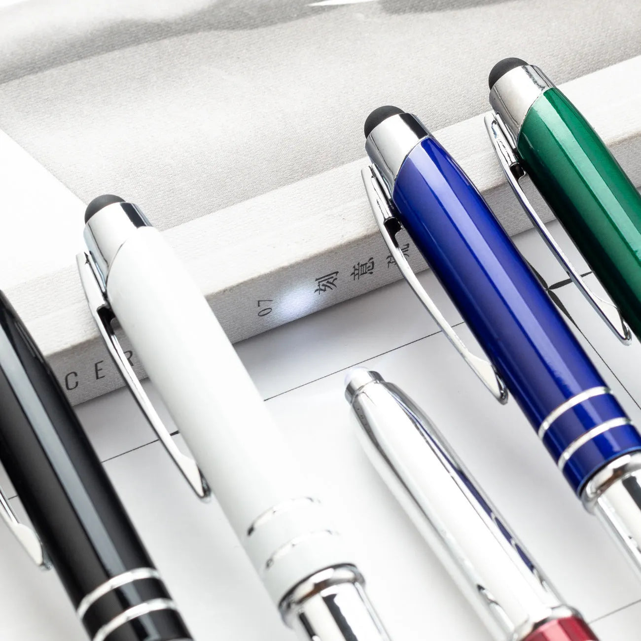Multifunctional metal pen with capacitive stylus tip, LED light, and five colour options for office use