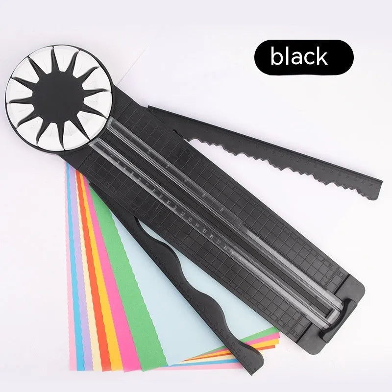 Plastic 12-in-1 paper cutting machine in pink or black colours with dotted cutting mechanism