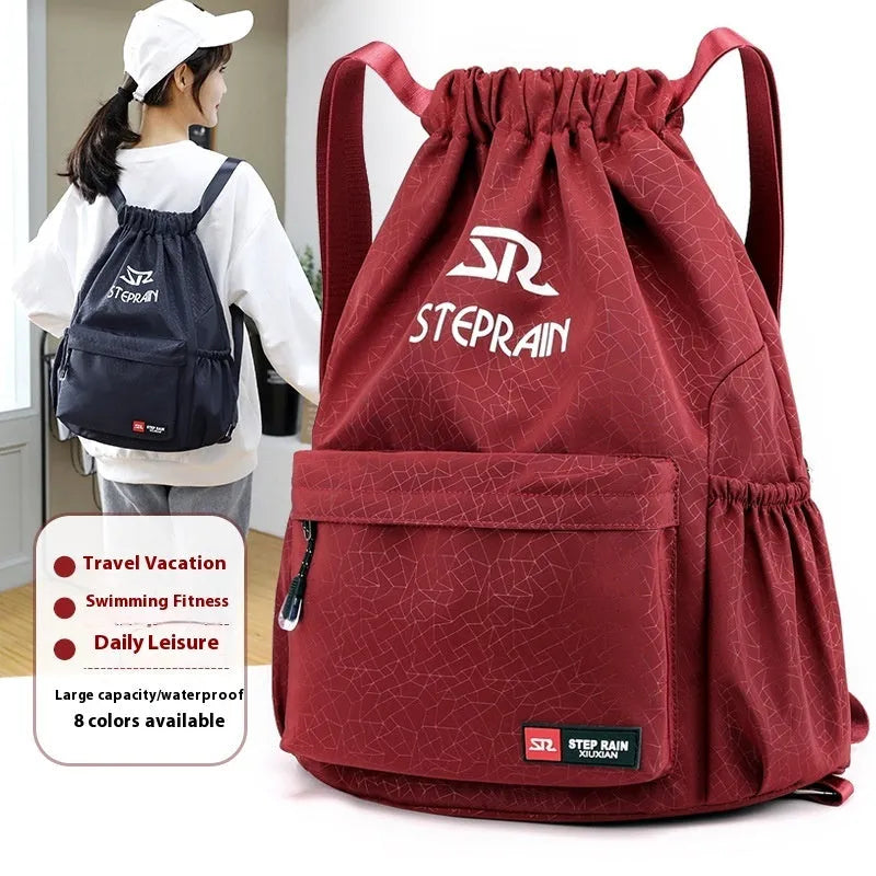 Solid colour drawstring backpack in Oxford cloth with double straps and a water pillow belt.