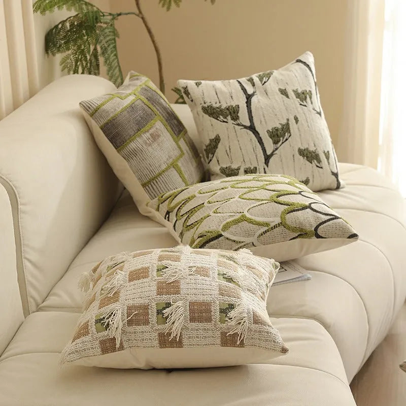 Square 45cm retro jacquard cushion cover with a woven plants and flowers pattern in a Nordic style, shown in one of eight available colours.